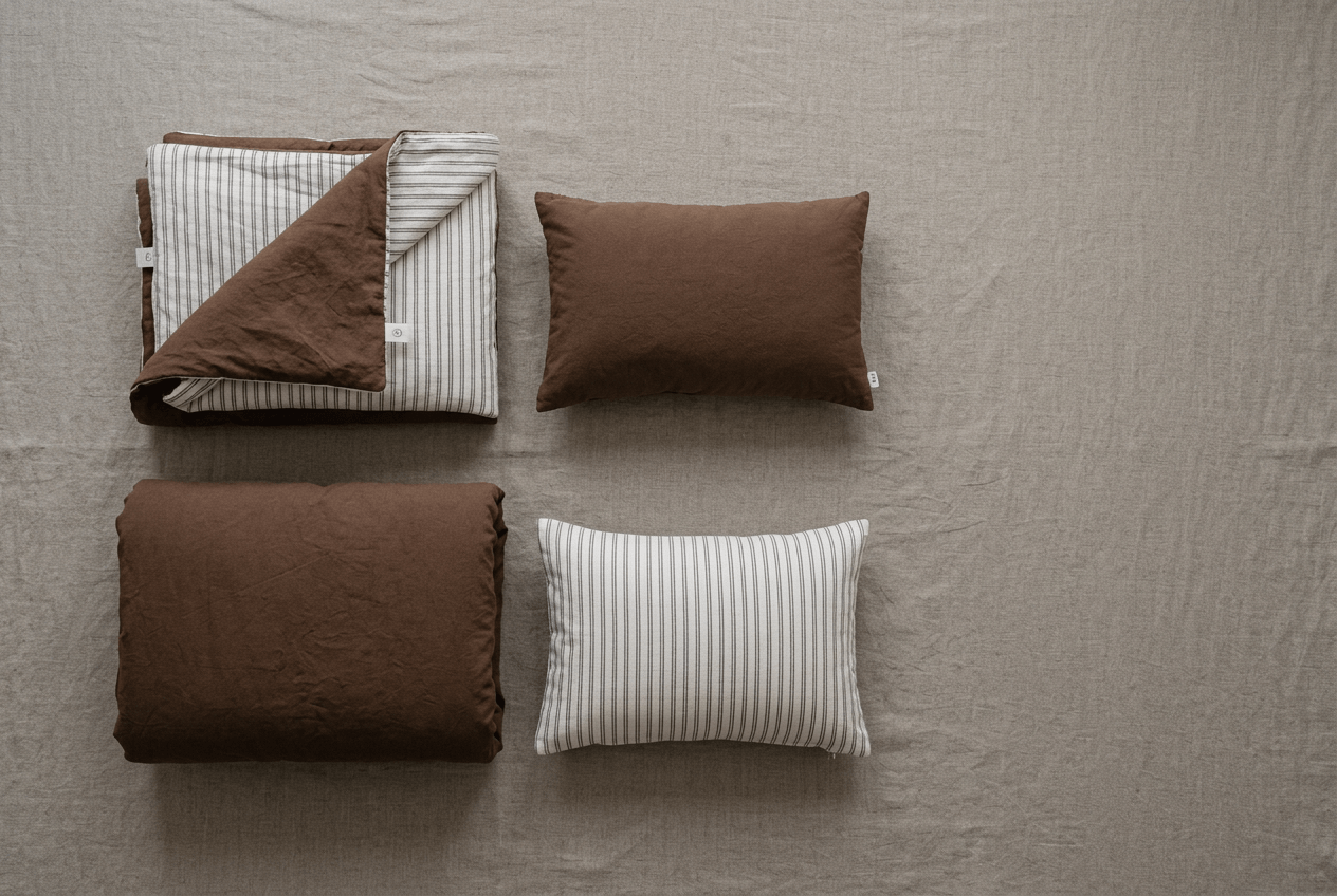 A dánda baby blanket and bib styled in calm colors